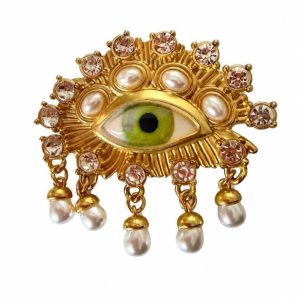 Brass eye brooch with crystals and dangling pearls