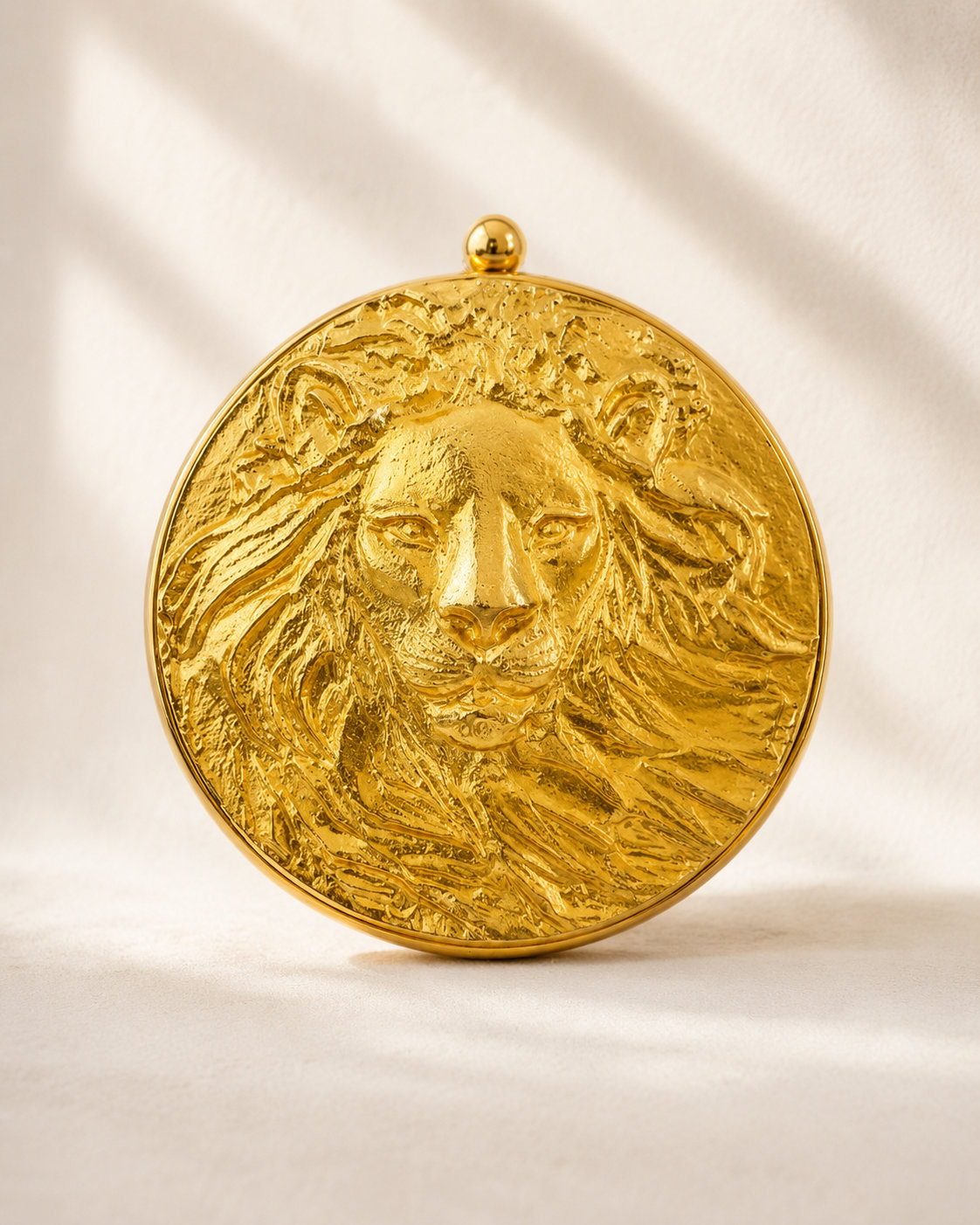 Gold lion head clutch, handbags category
