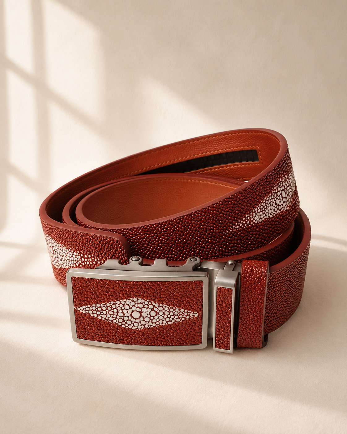 Red leather belt with a silver buckle, men's category